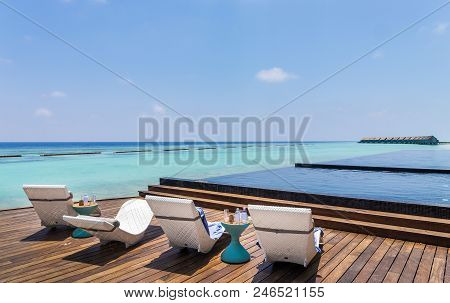 Deckchair And Beautiful Turquoise Indian Ocean In Maldives