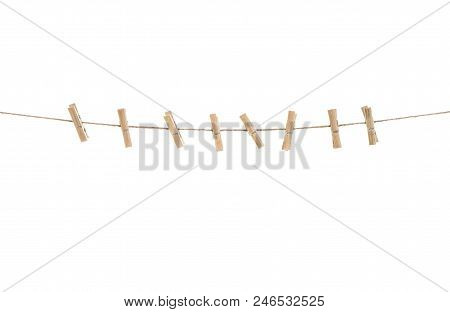 Clothes Line With Pegs Isolated On White Background. Clothespins On Rope