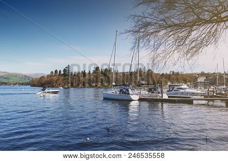 South Lakeland, Uk - April 2018: Bowness Pier With Boats For Hire And Tourist Cruises At Bowness-on-