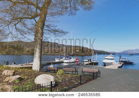 South Lakeland, Uk - April 2018: Bowness Pier With Boats For Hire And Tourist Cruises At Bowness-on-