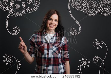 Feeling Happy. Cheerful Young Creative Artist Wearing Casual Clothes And Smiling While Pointing To T