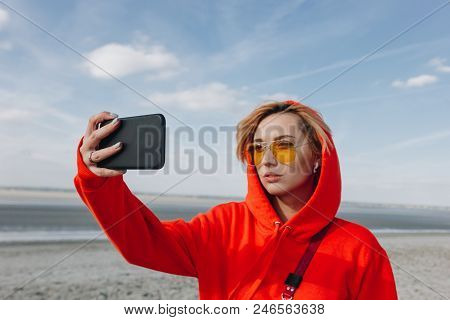 Attractive Girl In Sunglasses Taking Selfie On Smartphone On Beautiful Beach, Saint Michaels Mount, 