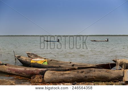 Cacheu, Republic Of Guinea-bissau - February 1, 2018: Fishermen On Their Canoes In The Cacheu River 