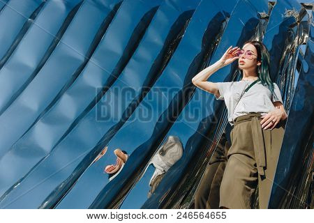 Wroclaw, Poland - 18 May 2018: Beautiful Young Woman In Front Of Sculpture Made Of Reflective Materi