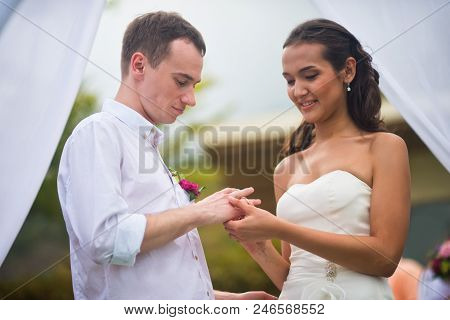 Newlyweds On Marriage Wear Each Other's Wedding Rings