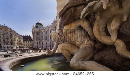 Fontain With Sculpture Of The Hofburg Imperial Palace In Michaelerplatz Square, Vienna
