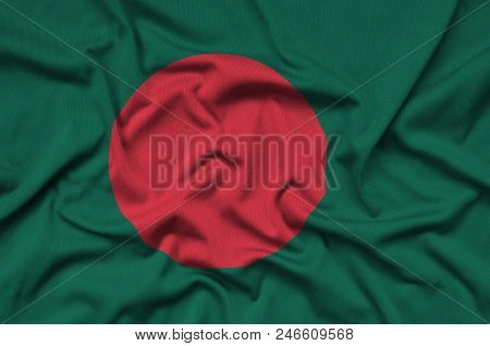 Bangladesh Flag  Is Depicted On A Sports Cloth Fabric With Many Folds. Sport Team Waving Banner