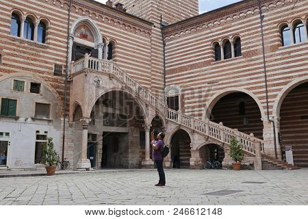 Verona, Italy - 14 June 2018: Tourist Photographing The Scala Della Ragione Stairs In The Palazzo De