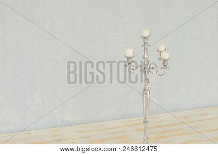 Candle On Candlestick On The White Background