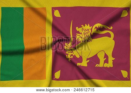 Sri Lanka Flag  Is Depicted On A Sports Cloth Fabric With Many Folds. Sport Team Waving Banner