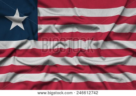 Liberia Flag  Is Depicted On A Sports Cloth Fabric With Many Folds. Sport Team Waving Banner