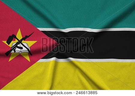 Mozambique Flag  Is Depicted On A Sports Cloth Fabric With Many Folds. Sport Team Waving Banner