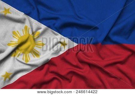 Philippines Flag  Is Depicted On A Sports Cloth Fabric With Many Folds. Sport Team Waving Banner