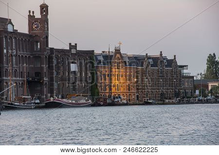 Harbor Of Wormer With Boats Moored Buildings. Netherlands Holland