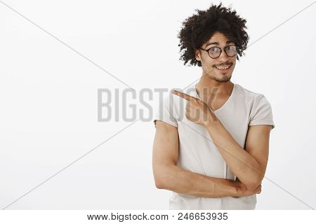 Indoor Shot Of Curious Relaxed And Happy Male With Tanned Skin And Moustache, Being Curious, Asking 