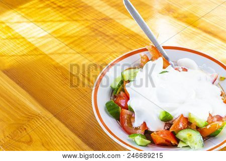 Helthy Food Concepts. Organic Salad  Consisting Of Mixture Of Fresh Green Cucumbers And Juicy Tomato