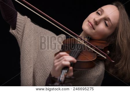 Passionate Violin Musician Playing On Black Background