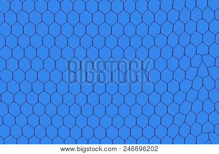 silhouetted iron net against a deep blue sky