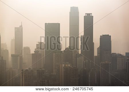 Big City Skyline In Smog With Skyscrapers Silouhettes