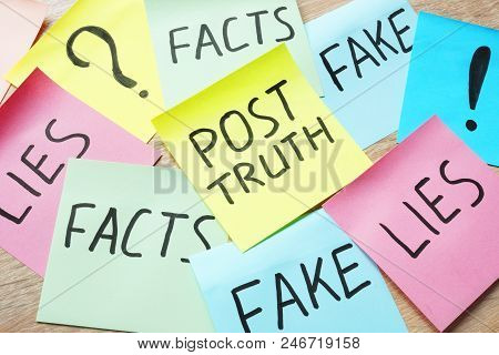 Memo Stick With Words Post-truth And Lies, Fakes And Facts.