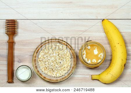 Face Mask From Oatmeal, Yogurt, Banana  And Honey. Ingredients For Homemade Facial Mask Decoreted Wi