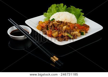 Vietnamese Dish Bo Luc Lac (saute Diced Beef) Is A Cubed Beef Sauteed With Cucumber, Tomatoes, Red O