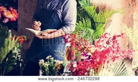 Flowerist working in the flower shop vintage style