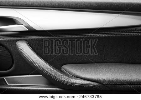 Door Handle With Power Window Control Buttons Of A Luxury Passenger Car. Black Leather Interior Of T