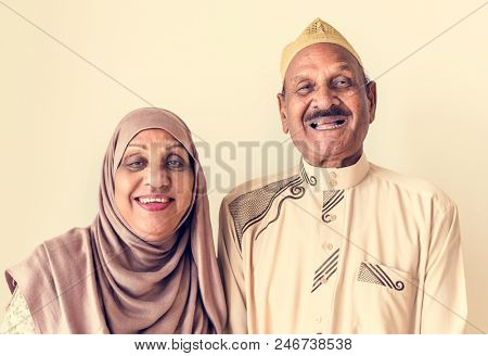 Senior Muslim couple at home
