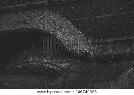 Racing On Off-road Cars. Fragment Of Car Stuck In Dirt, Close Up. Wheel In Deep Puddle Of Mud Overco