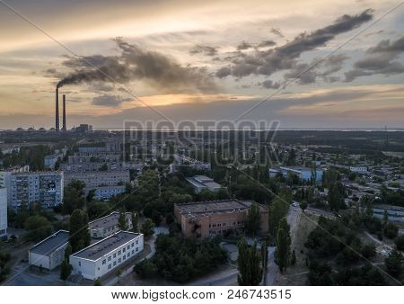 Aerial View Of Town, Nuclear Power Station, Thermal Power Station And Sky At Sunset. Aerial Photogra