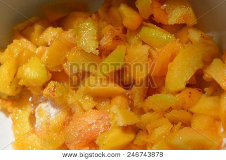 Fruit Sliced Pieces Of Freshly Cut Apricot Cut With A Knife And Sprinkled With White Sugar