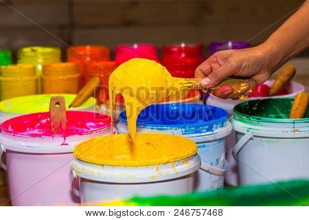 Yeoolw Color Of Plastisol Ink In White Plastic Barrel. Plastisol Ink Is Specially For Print On Tee S