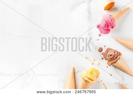 Homemade Chocolate, Vanilla, Berry Ice Cream In Ice Cream Cones, White Marble Background Copy Space 