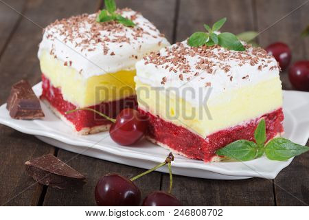 Home Made Cherry Cake With Vanilla And Black Cherries On Wooden Table