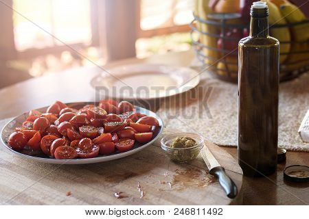 Fresh Cherry Tomatoes Under Oil And Seasoning On The Table, Summer Terrace. Concept Of Healthy Food,