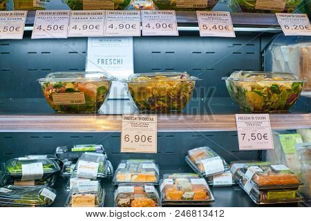 MILAN, ITALY - CIRCA NOVEMBER, 2017: assortment of food on display for sale at Carrefour Express in Milan.