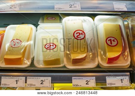 MILAN, ITALY - CIRCA NOVEMBER, 2017: assortment of cheese on display for sale at Carrefour Express in Milan.