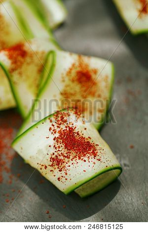 Ground Red Sumac Berries sprinkled on cucumber slice