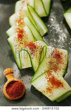 Ground Red Sumac Berries sprinkled on cucumber slice