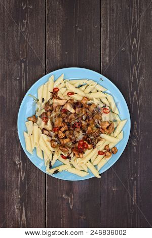 Healthy Nutritious Meal With Forest Mushrooms. Pasta Penne With Golden Chanterelle Mushrooms And Chi