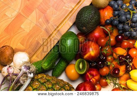 Mediterranean Food Background. Assortment Of Fresh Fruits And Vegetables, Tomatoes, Pineapple, Banan