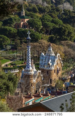 Barcelona, Spain - March 28, 2018: Famous Casa del Guarda in Park Guell in Barcelona, Spain. Top view
