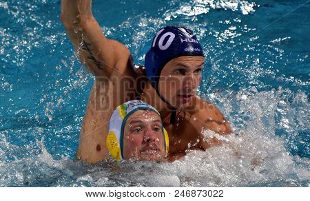 Budapest, Hungary - Jul 17, 2017. VARGA Denes (HUN) waterpolo player (in blue) fights with GILCHRIST Jarrod (AUS). FINA Waterpolo World Championship was held in Alfred Hajos Swimming Centre.