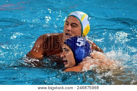 Budapest, Hungary - Jul 17, 2017. VAMOS Marton hungarian waterpolo player (in blue) fights with KAYES Joe (AUS). FINA Waterpolo World Championship was held in Alfred Hajos Swimming Centre.