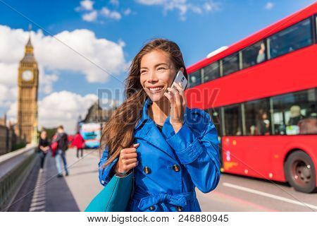 London city businesswoman calling on mobile phone