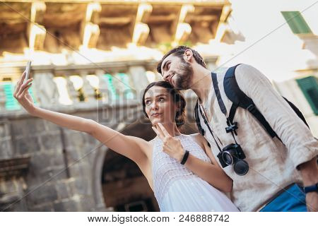 Young Couple Taking A Selfportrait With Smartphone. People Traveling