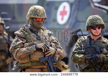 Feldkirchen / Germany - June 9, 2018: German Soldiers Stands Near Military Vehicles On A Open Day On