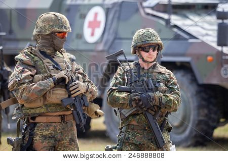 Feldkirchen / Germany - June 9, 2018: German Soldiers Stands Near Military Vehicles On A Open Day On