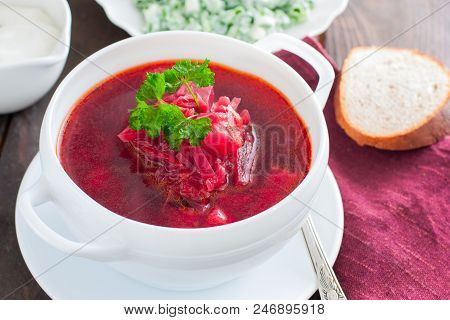 Ukrainian Traditional Borsch. Russian Vegetarian Red Soup In White Bowl On Black Background. Top Vie